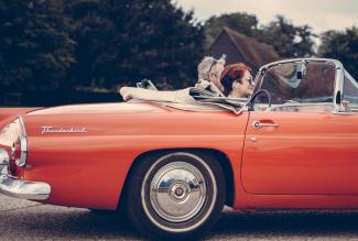 two person riding vintage coupe by Clem Onojeghuo courtesy of Unsplash.